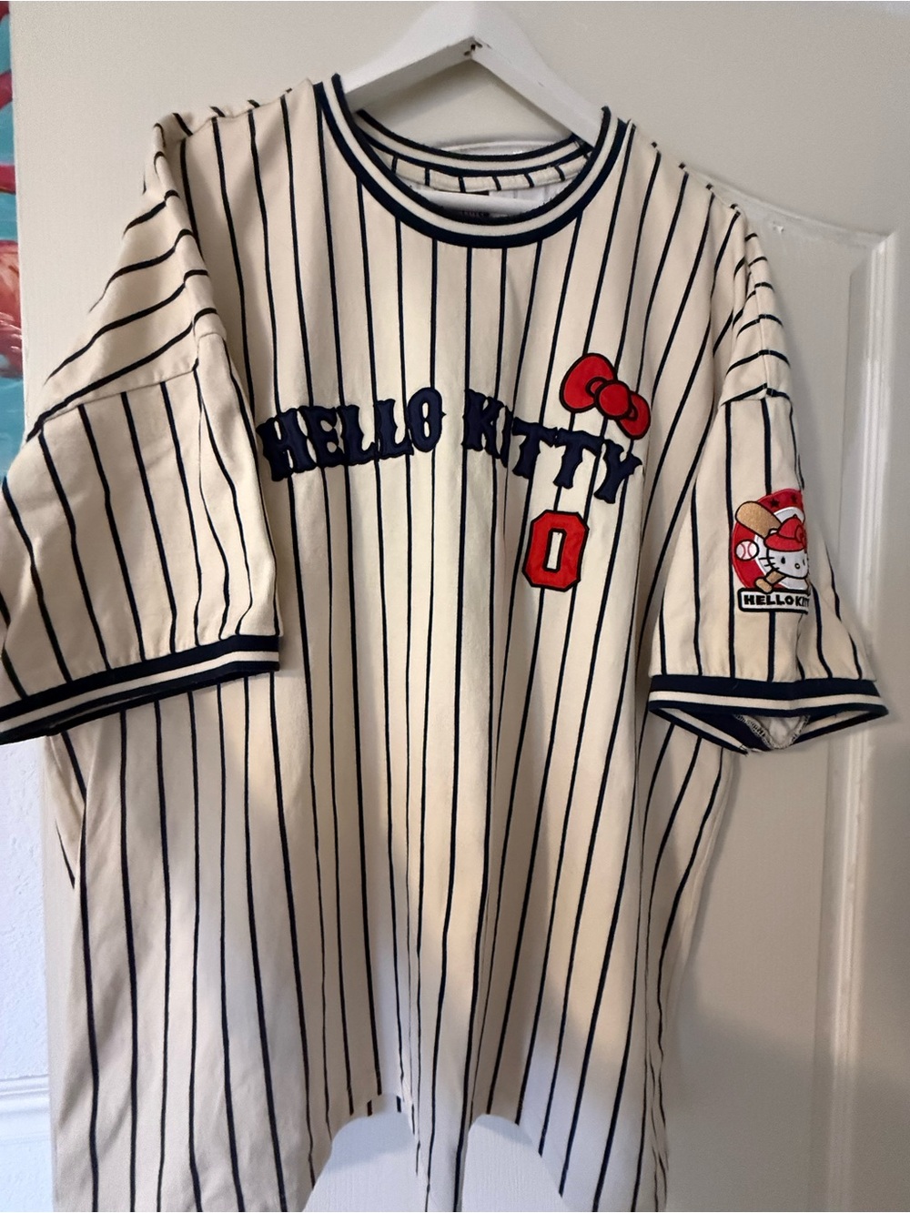 Sanrio Hello Kitty Cream Pinstripe Tee with Red Bow and Navy Trim